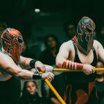 masked wrestlers in action at lucha libre event