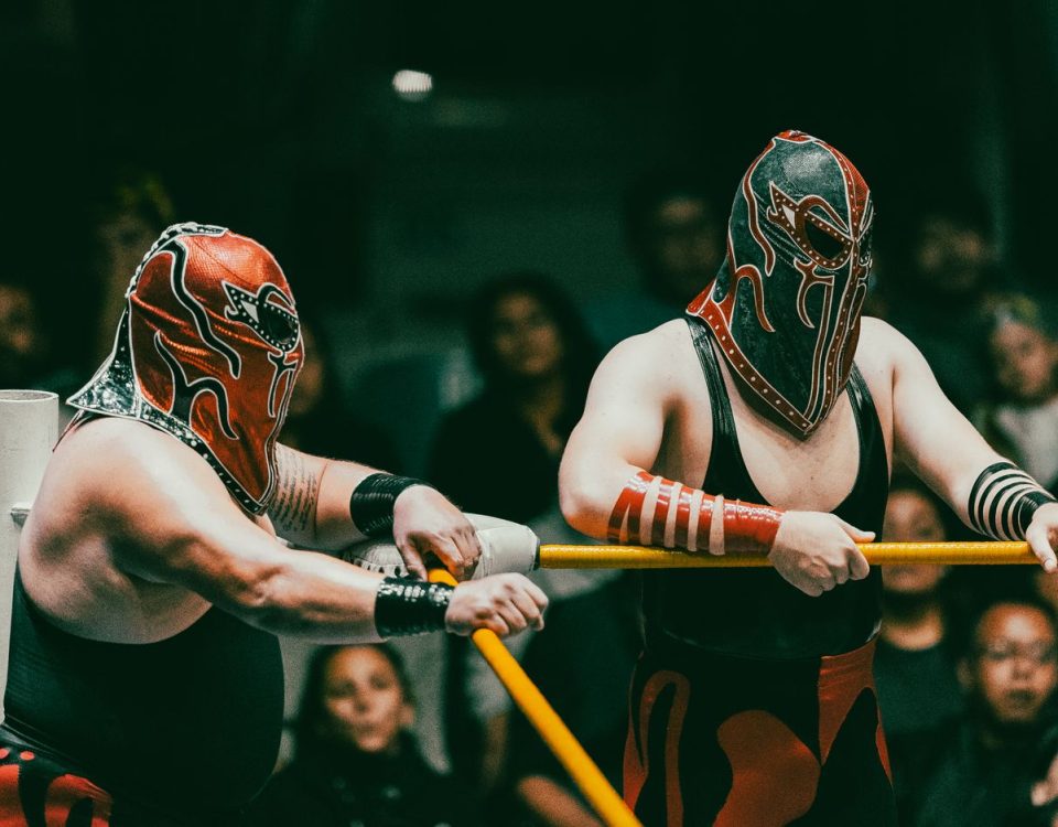 masked wrestlers in action at lucha libre event